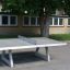 Concrete table tennis, free-standing table in outdoor setting.