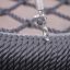 Close-up of a Swing seat: Bird's nest seat with rope and metal chain detail.