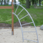 Panther wooden playhouse outdoor climbing structure in a park setting