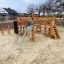 Panther wooden playhouse for children on a sandy playground