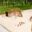 Panther wooden playhouse in a park on a sandy playground