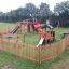 Playground with Locomotive Nature train playhouse and slide.
