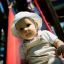 Baby sliding down the Logo Tower playhouse with slide.