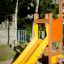 Yellow slide for children in the Sigma playground set.