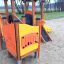 Children's playground with wooden Smart playhouse and slide.