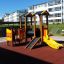 Smart playhouse with slide on playground.