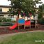 wooden sandpit and a playground locomotive