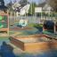 Wooden Sandpit in a colorful outdoor playground.