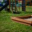 Wooden Sandpit in Playground with Slide and Climbing Frame