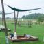 Children playing in the Sandpit playground under canopy.