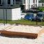 Wooden Sandpit in Residential Playground Area