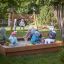 Children playing in a Sandpit on a playground.