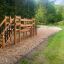 Outdoor wooden playground structure Bridge in a natural park setting.