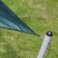 Sun Shade Triangle 5x5x5 Atlantis (Metal) installed on grassy lawn.