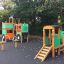 Playground equipment shaped like a tractor and train combination.