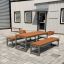 Outdoor furniture set Kyoto with table and benches outside a modern building.