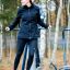 Woman using Set 2 outdoor fitness equipment in a park.