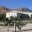 Outdoor exercise equipment Set 4 against a background of buildings and mountains.