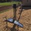 Outdoor workout station - Set 5 fitness equipment on wood chip ground in park setting.
