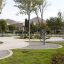 Outdoor fitness area with Set 6 equipment and green surroundings.