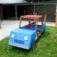 Outdoor playground Truck for children with blue body and red roof.