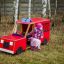 Child playing in Fire brigade truck playground equipment.