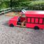 Toy fire brigade truck on playground.