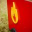 Red fire brigade truck with yellow flame logo.