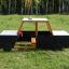 Wooden police car play structure in a park.