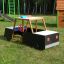 Wooden playground structure in the shape of a police car.