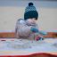 Child playing with sand in All Accessible Sandpit at playground