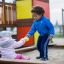 children playing in the all accessible sandpit