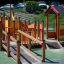 Gamma - colorful playground equipment with slides and bridges in a park setting.