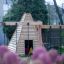 wooden wigwam playhouse in the garden