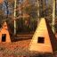 wooden wigwams in the forest