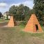 wooden wigwam playhouses on the playground