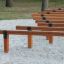 Wooden balance beams Hip Hop on playground sand surface.