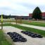 Obstacle course with Tires (10 pcs) set up on a gravel path in a playground.
