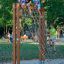 Children climbing and sitting on V-shape Net Large wooden playground climbing frame.