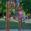 V-shape Net Large climbing net on wooden frame in playground with children playing