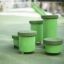Green Jumping Pegs (5 pcs.) on a playground.