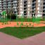 Outdoor playground equipment, green Jumping pegs (5 pcs.) on orange surface.