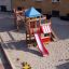 Playground Set with a slide, a metal ladder installed on the sand.