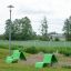 Green Lounge chair outdoor playground seating on grass near lamppost