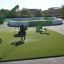 Modern playground with green and white lounge chair and equipment