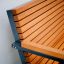 Close-up of the Kyoto Sofa's wooden armrest and slatted backrest.