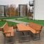 Kyoto Sofa outdoor set with wooden benches and table in a modern courtyard.
