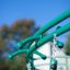 Green Sirius steel structure playground equipment close-up.