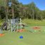 Sirius steel structure playground equipment on a colorful outdoor play area in a park.