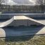 Double Quarter-Pipe skate ramp in outdoor skatepark.